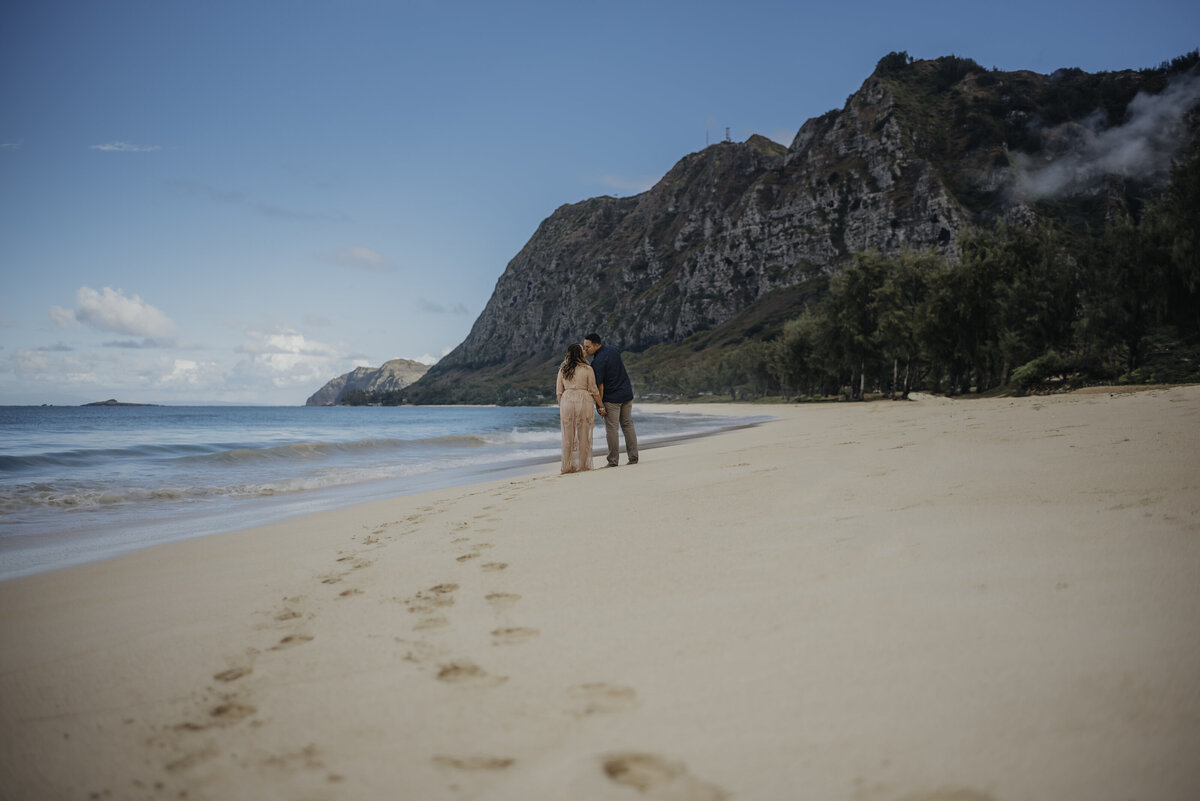 Couples walking on beach in hawaii