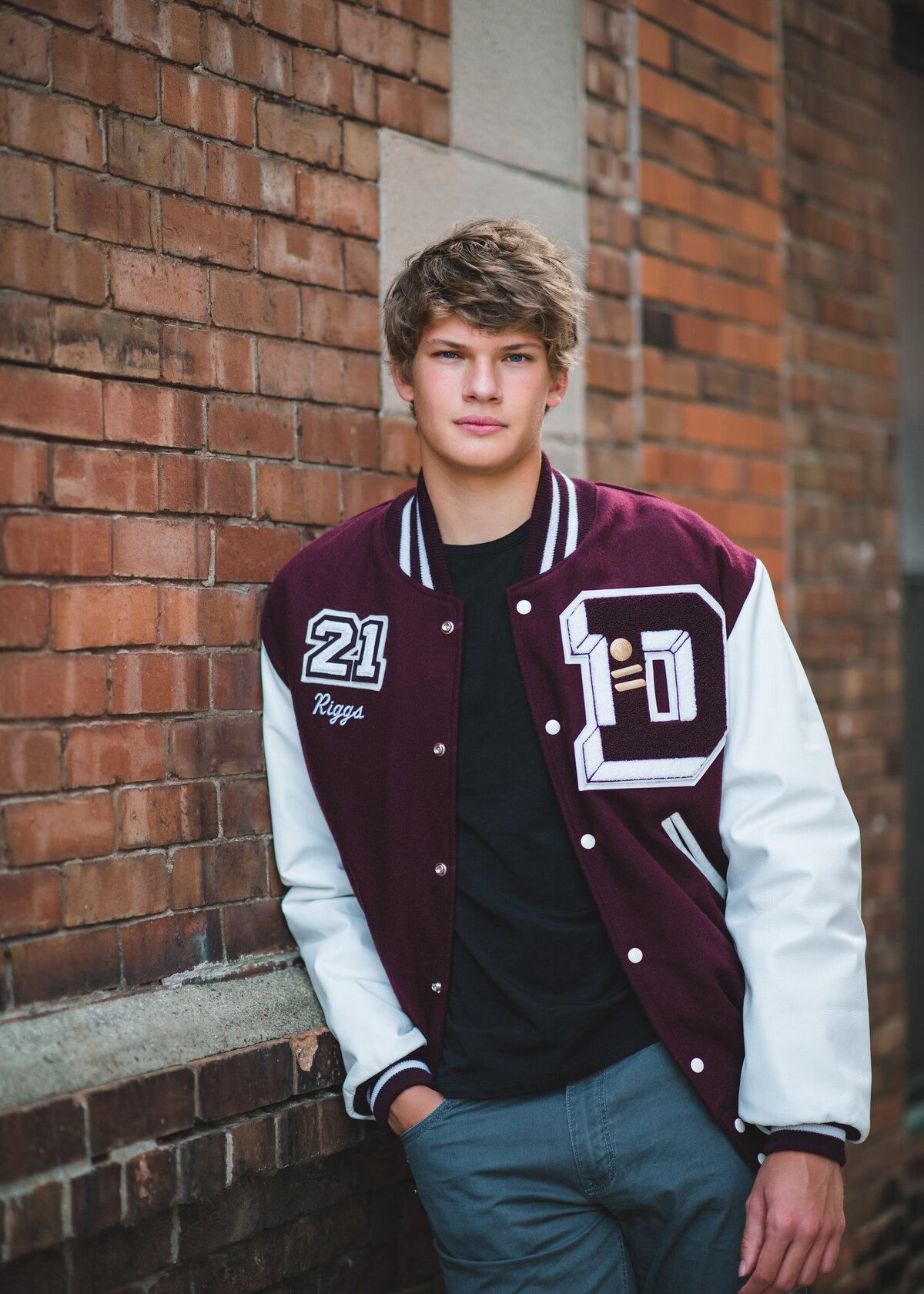 Des Moines-Iowa-Senior-Guy-Photographer-Theresa-Schumacher-Photography-Urban-Alley-Letterman-Jacket