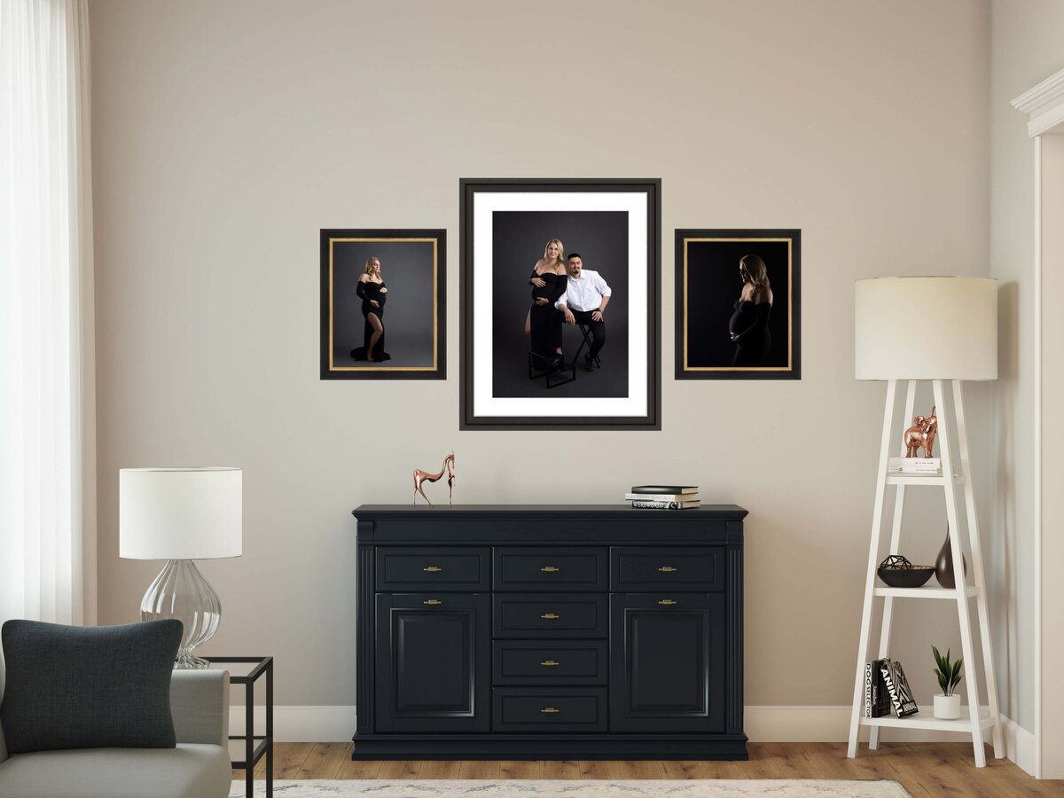 portraits of a pregnant woman and spouse hanging on a wall in a Colorado Springs home