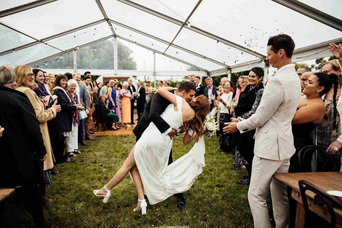 groom_kissing_bride_dipped