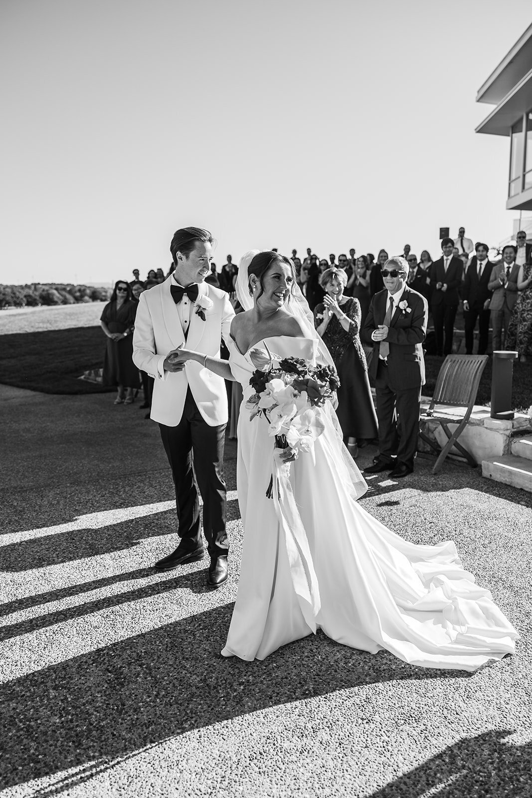 Bride taking the hand of her groom just after she walked down the aisle. Taken at The Marion, Canberra ACT