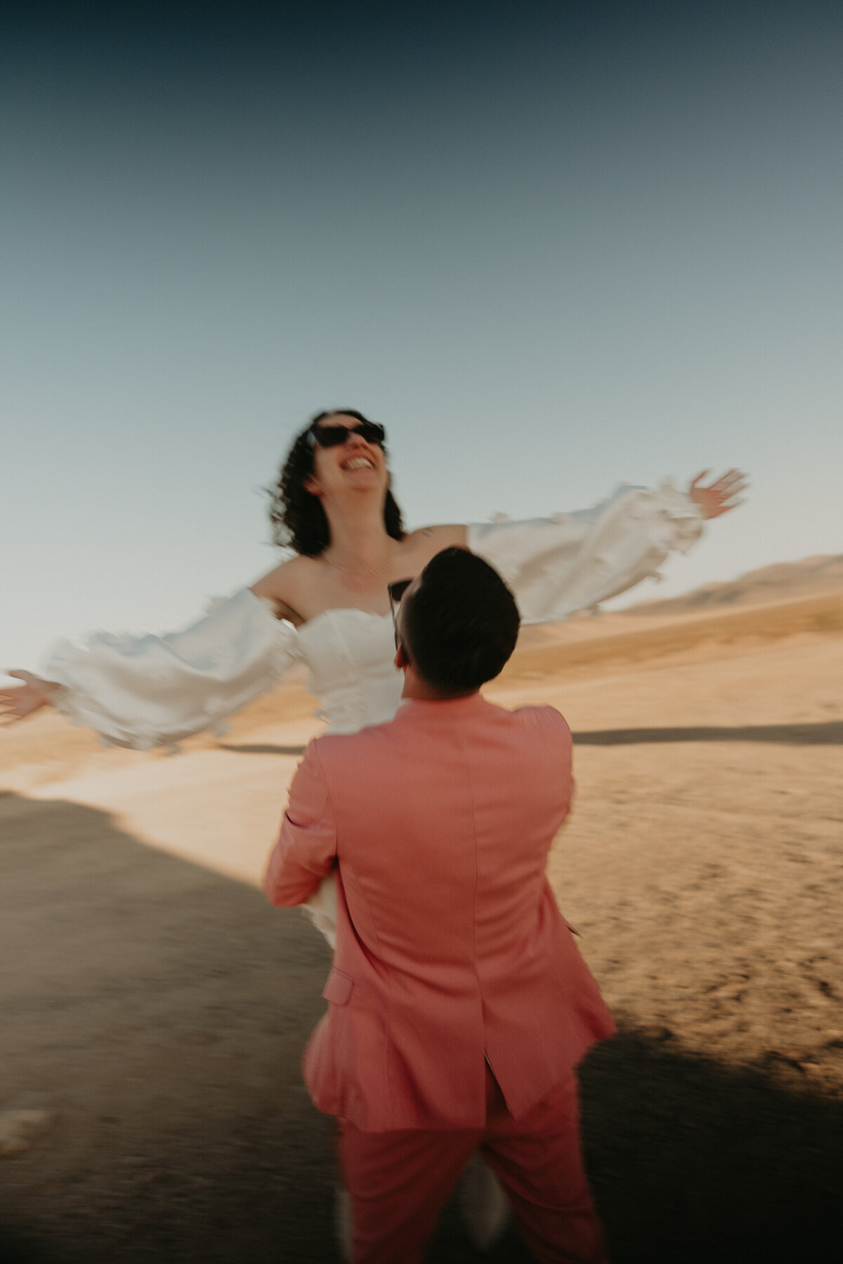 Bride and Groom in front of Seven Magic Mountains in Las Vegas.
