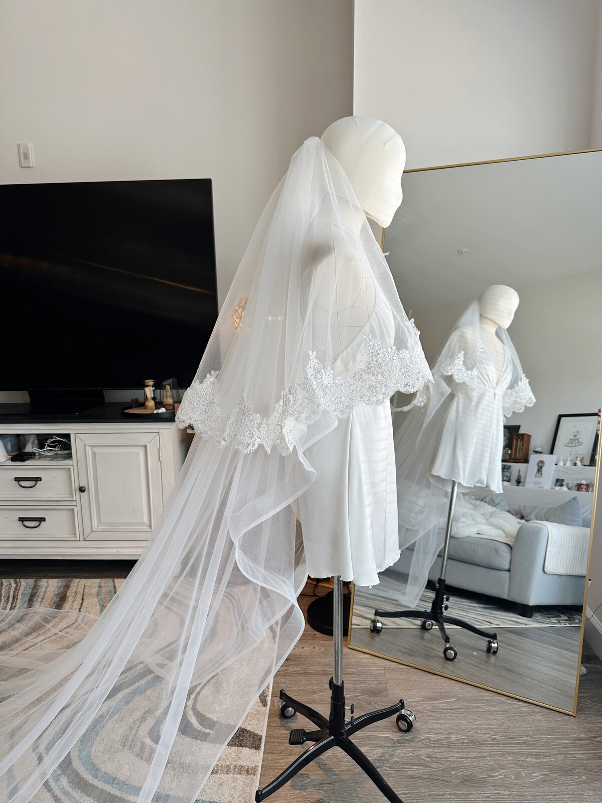 Cathedral-length veil styled with short lace blusher layer
