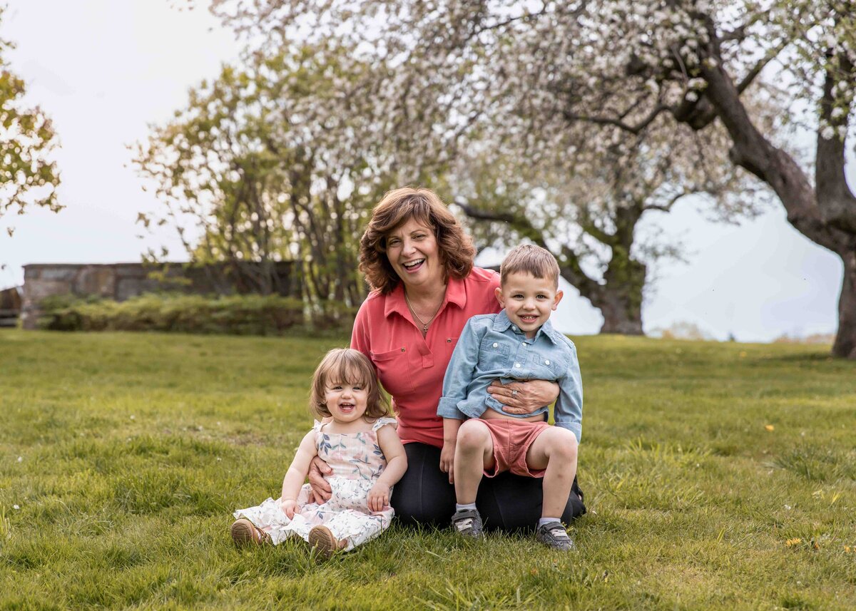 grandmother and grandchildren pose for a photo