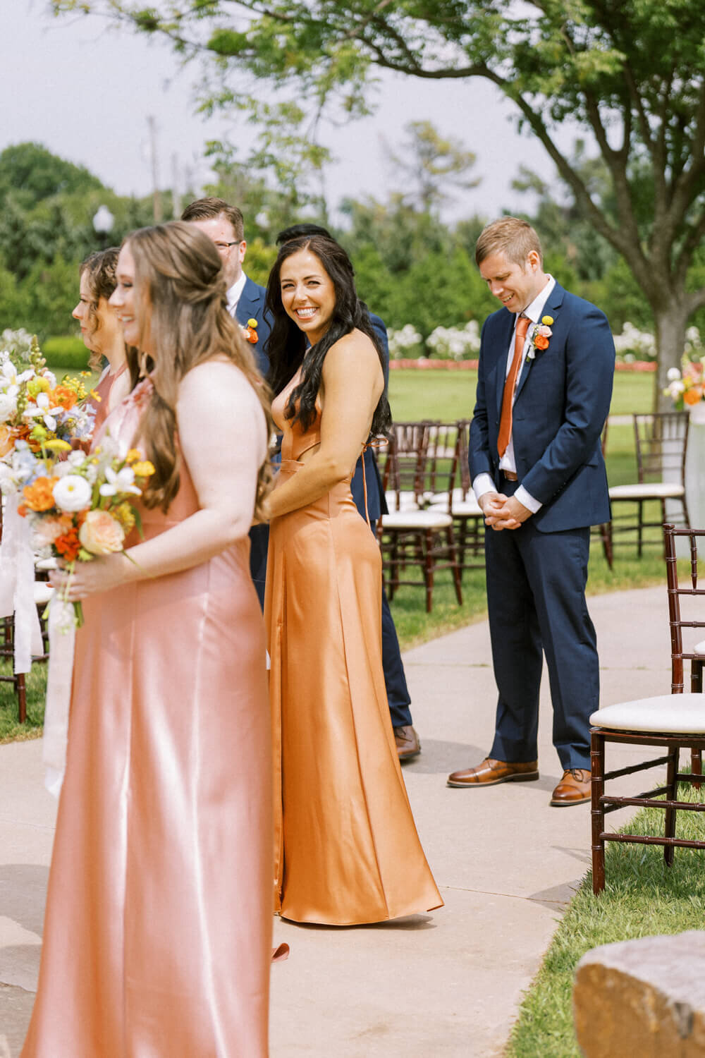 bridesmaid-in-satin-dress-smiling-at-camera