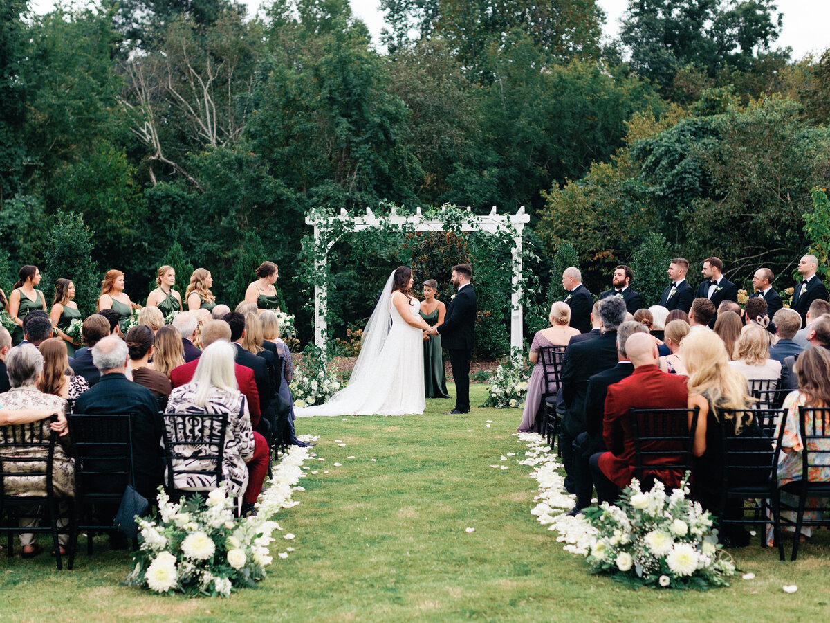 outdoor ceremony with white flowers