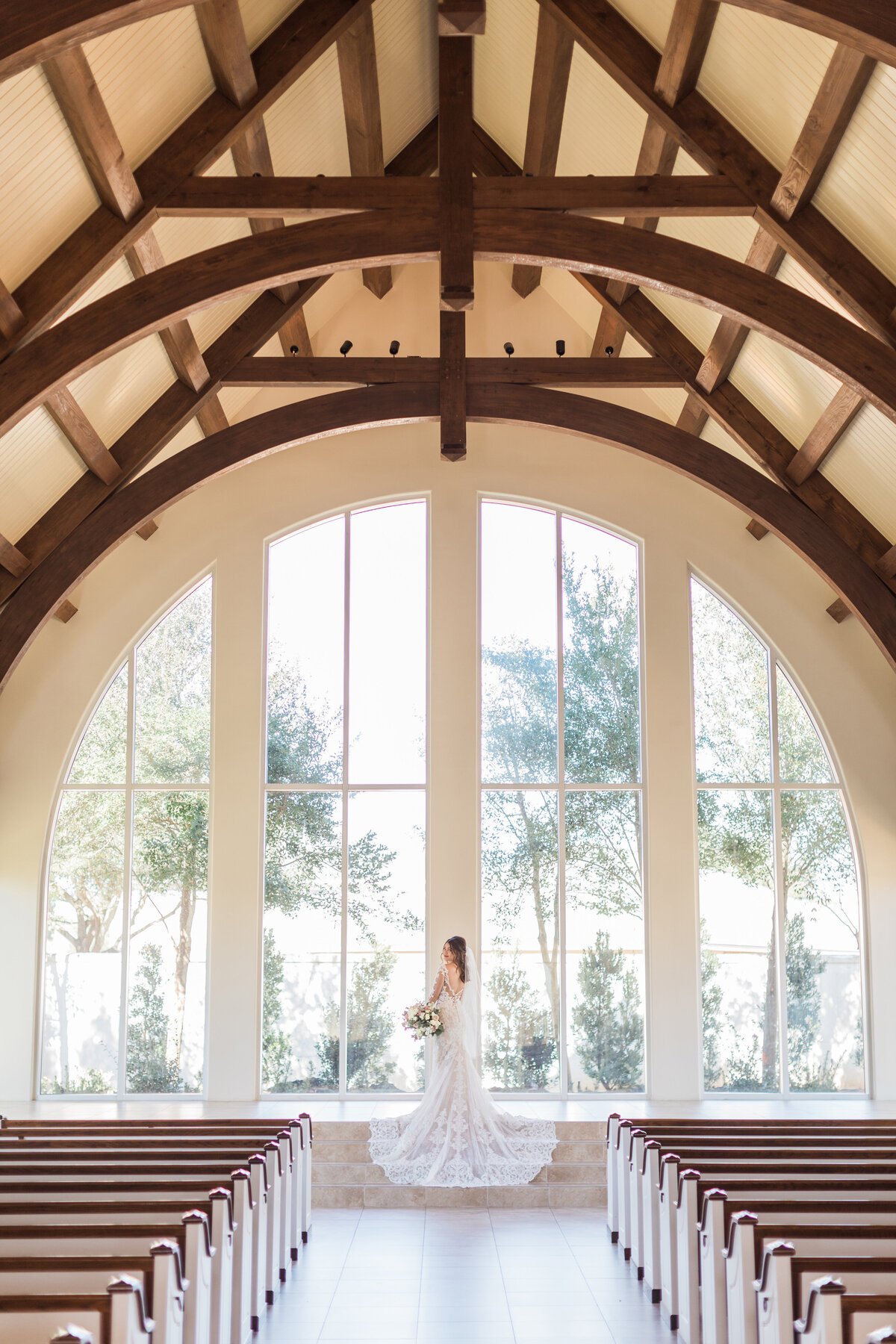 A bride in the Chapel at Ashton Gardens Houston West