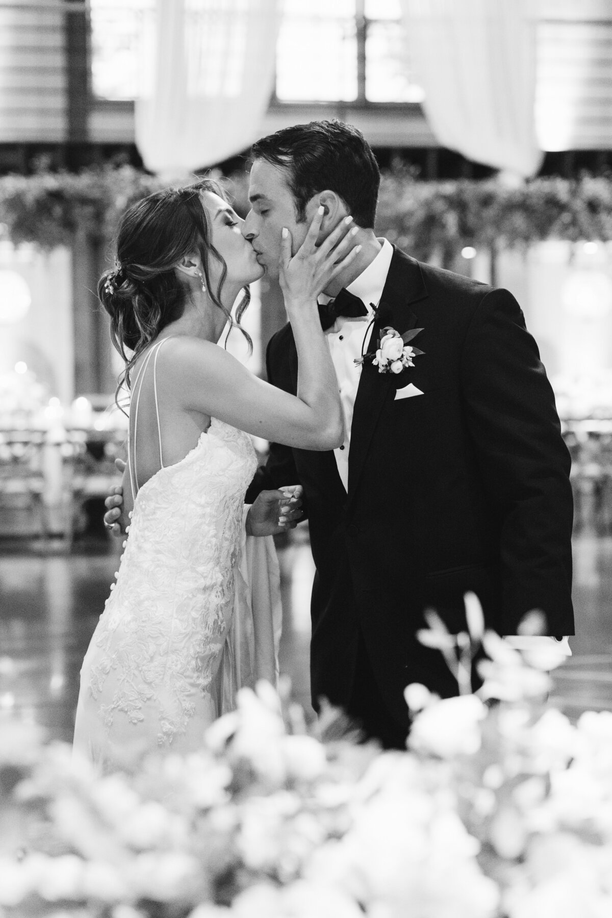 bride-and-groom-kissing-at-reception
