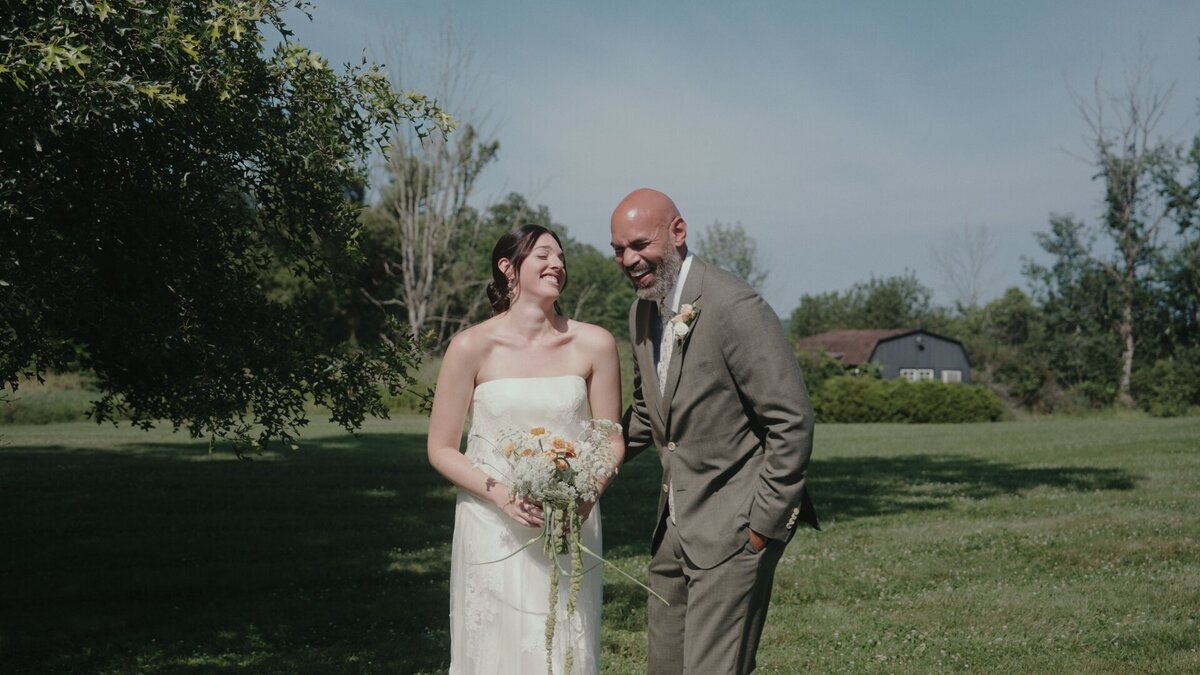 bride and groom laughing after their first look.