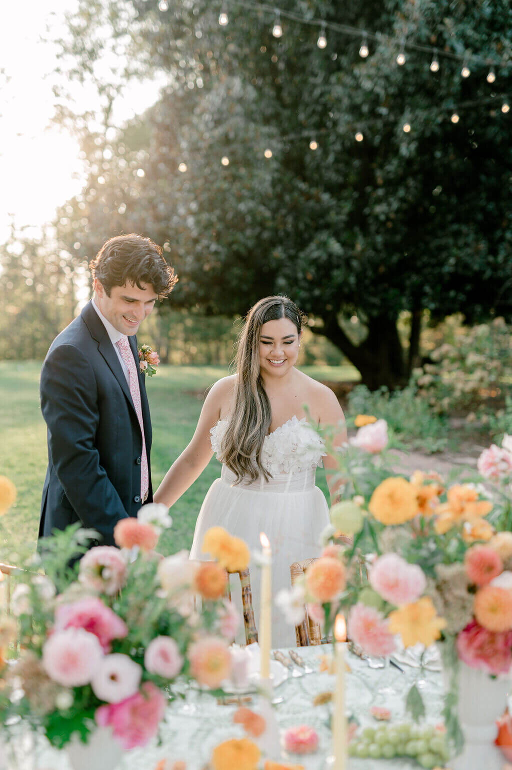 bride and groom looking at the flowers