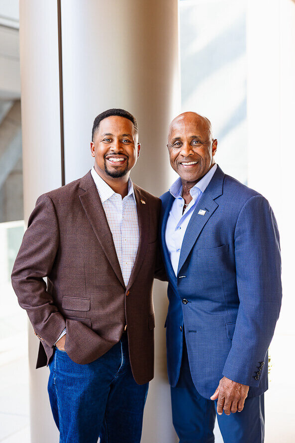 Father and son pose together for their business branding headshots.