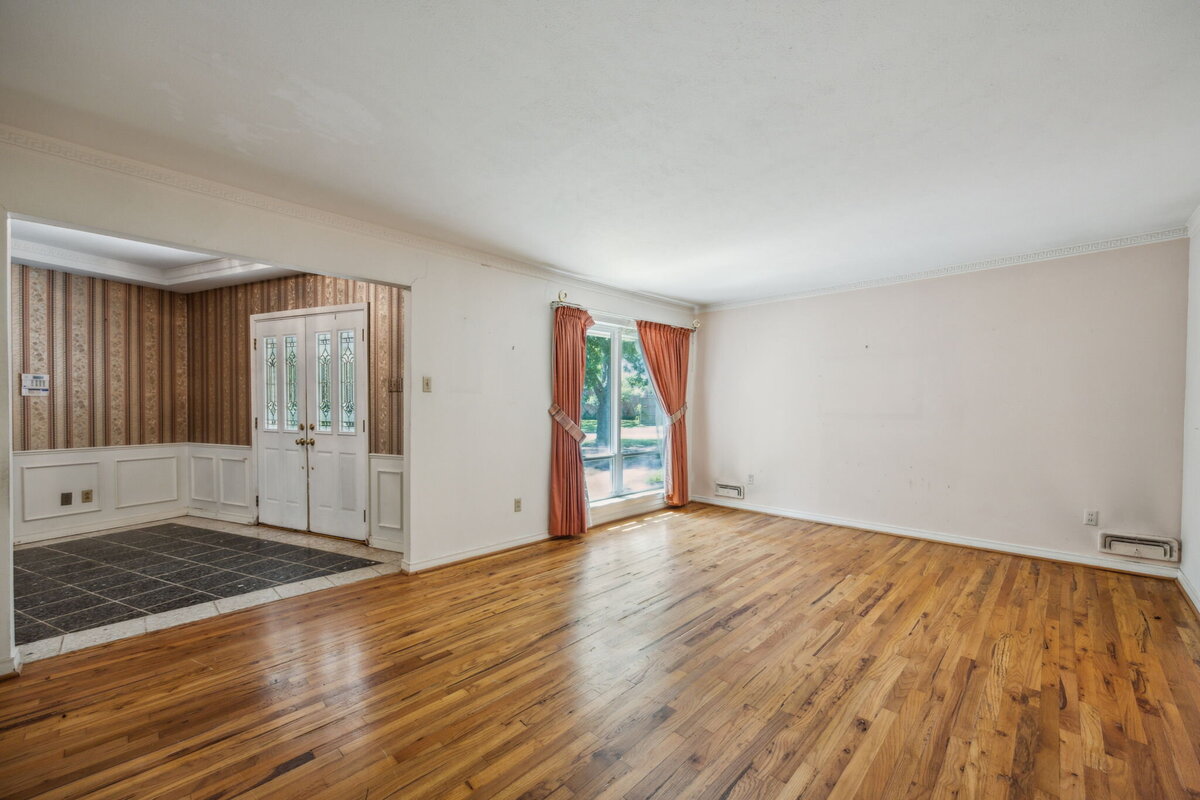 14214_edgecrest_dr_dallas_tx_formal_living_room_-sunny_front_room_with_large_window_and_original_hardwood_floors-_haven_realty_group