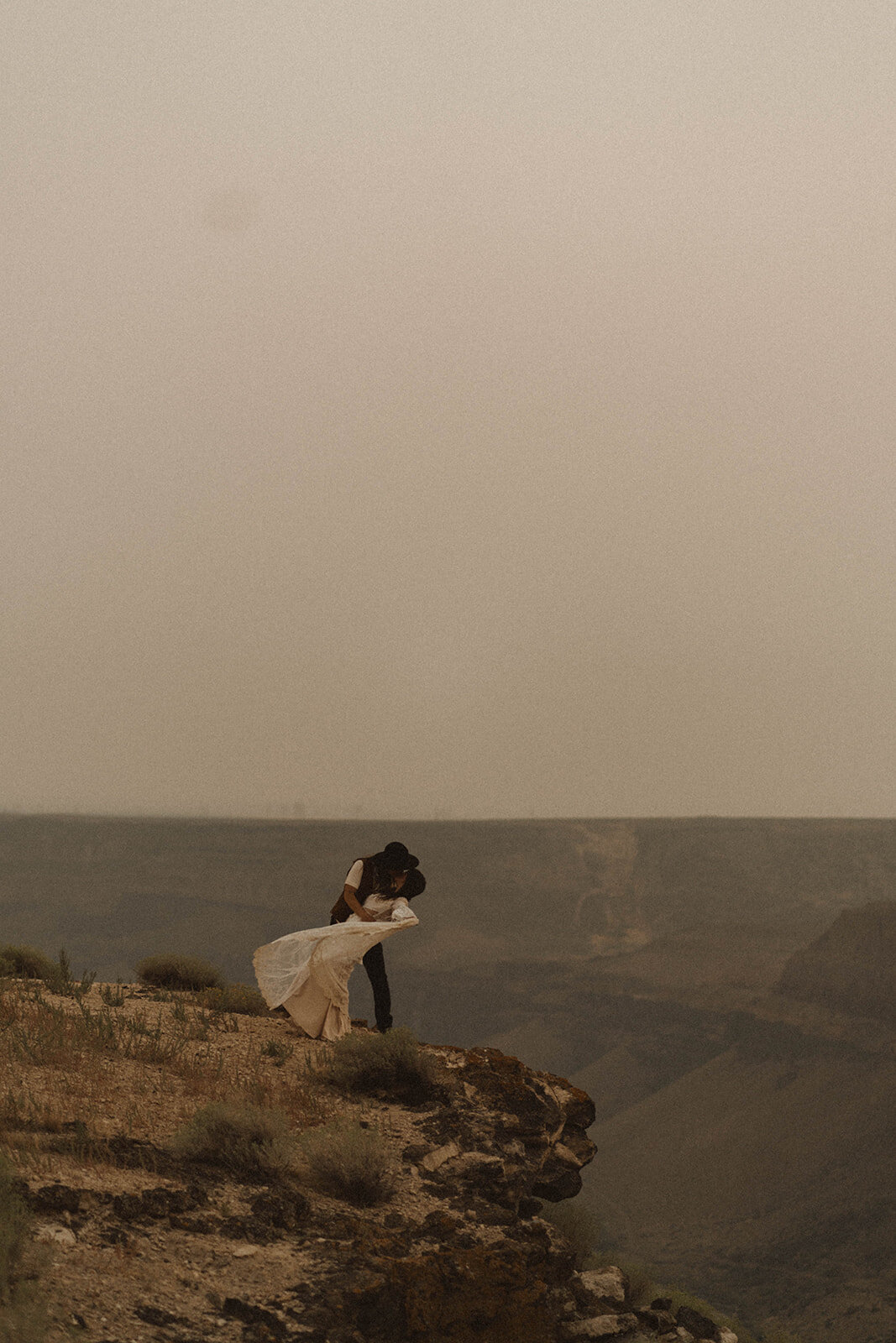 two brides on the rim of the snake canyon during their idaho elopement