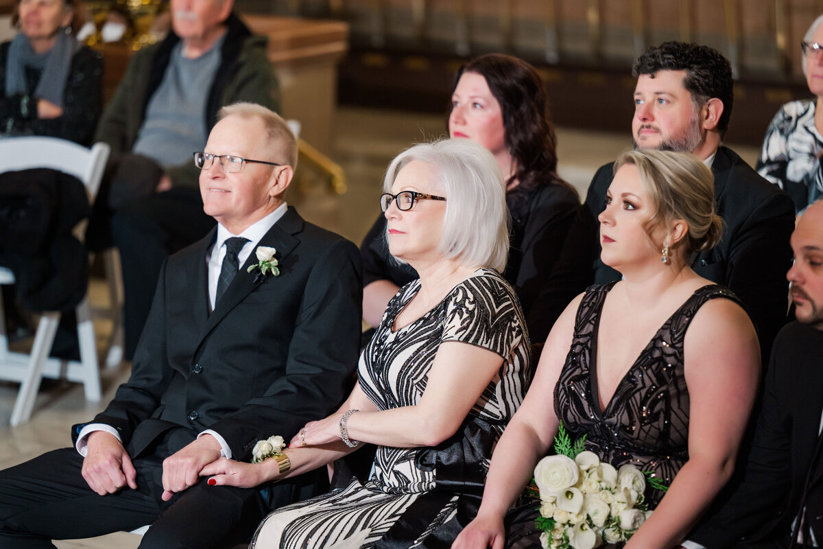 family watching the small wedding ceremony