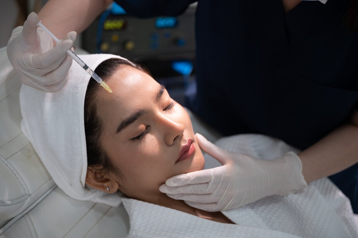 young-asian-woman-making-cosmetology-treatment-ski-2023-11-27-05-37-06-utc