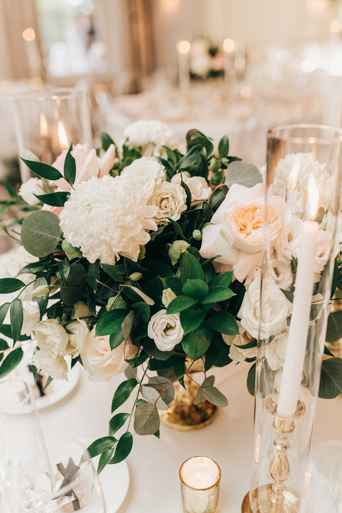 Rose, eucalyptus, and chrysanthemum wedding centrepieces