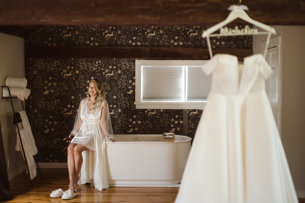 bride in the upstairs bridal suite at the inn at millrace pond nj wedding venue