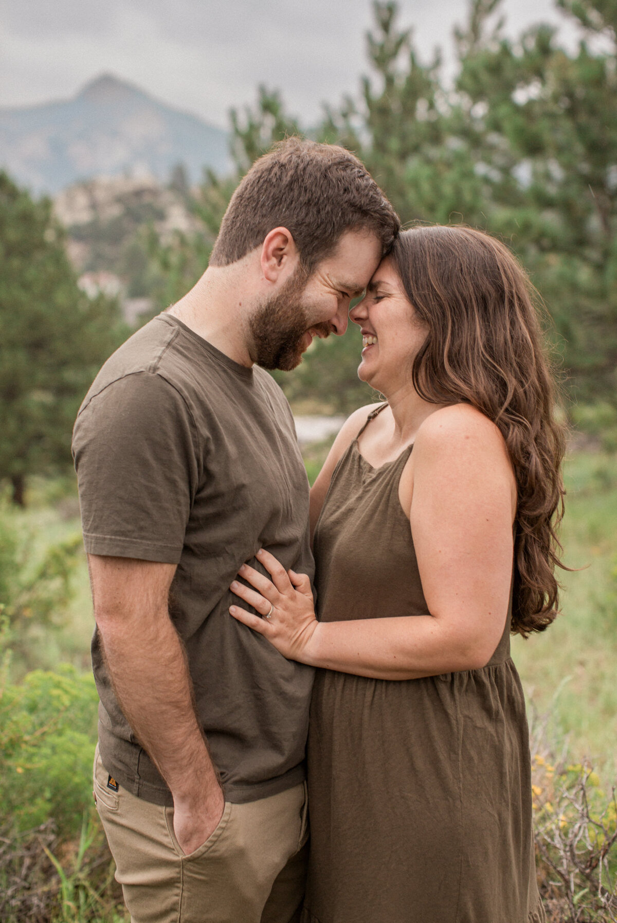 A couple embrace lovingly during their photography session just outside of Rocky Mountain national park