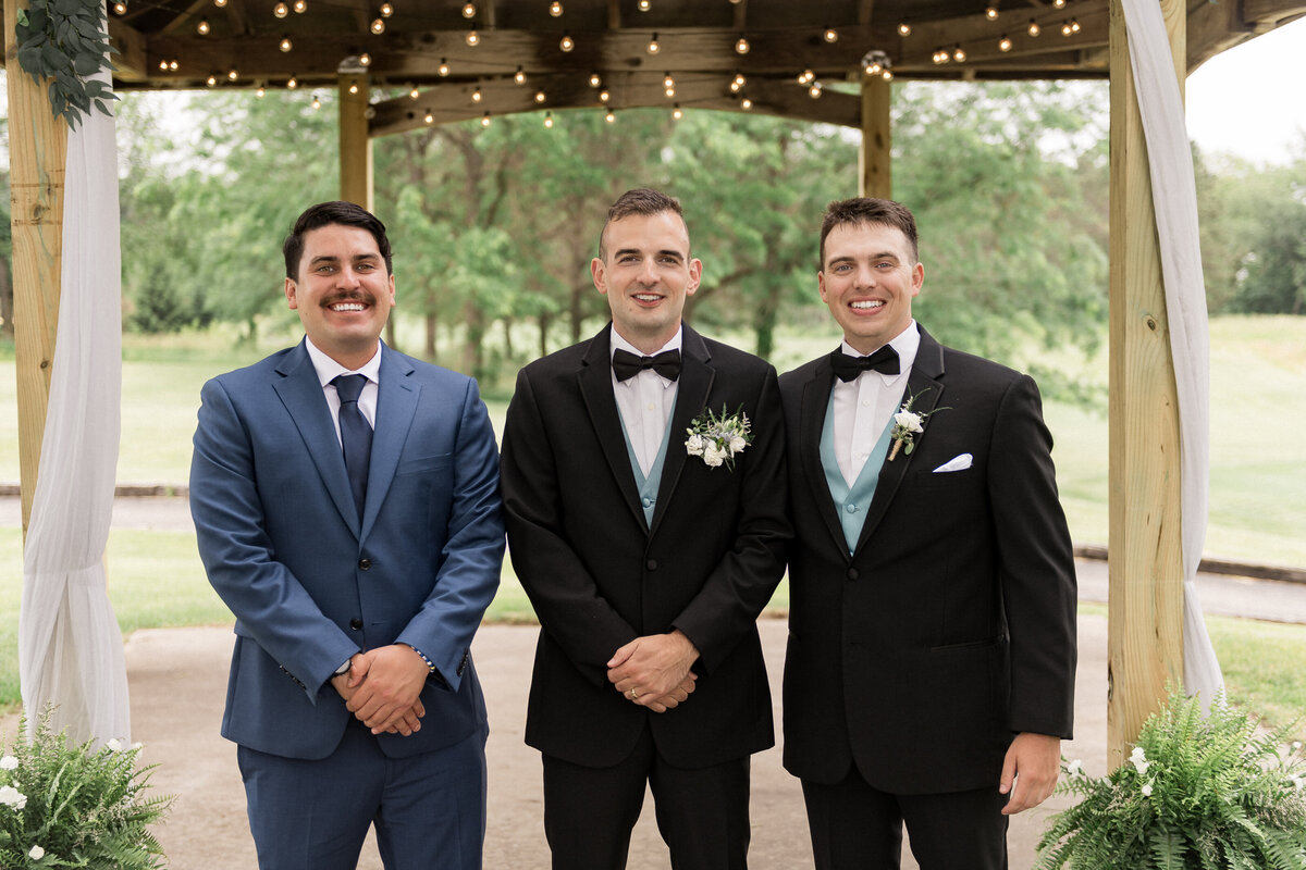Groom tying knot close-up