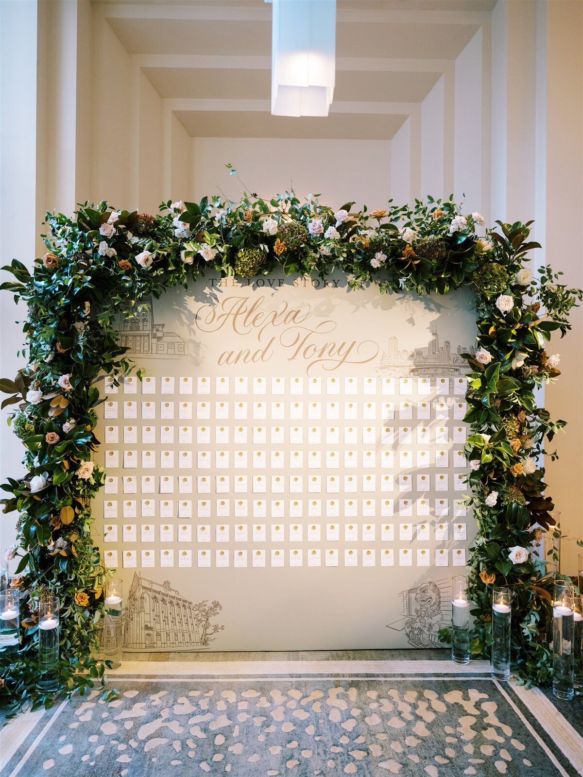 A picture of the table assignments under a floral arch.