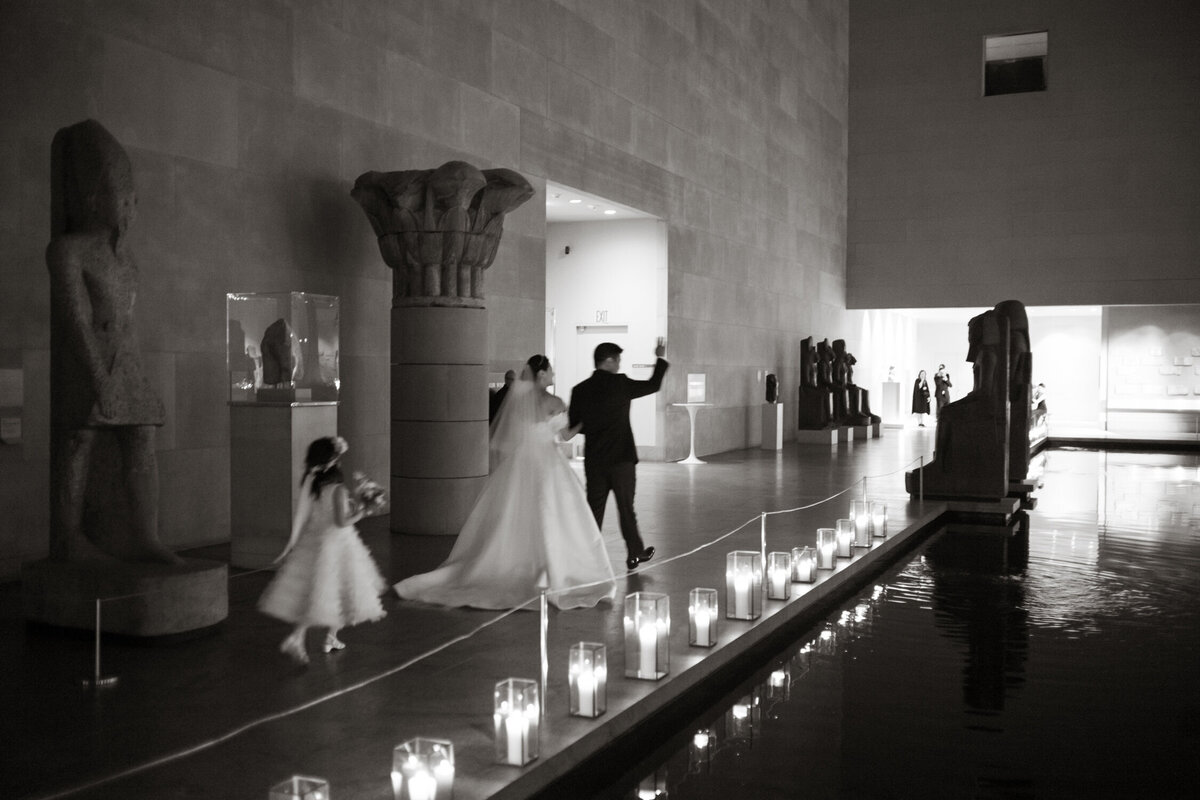 Wedding couple walking through the Met