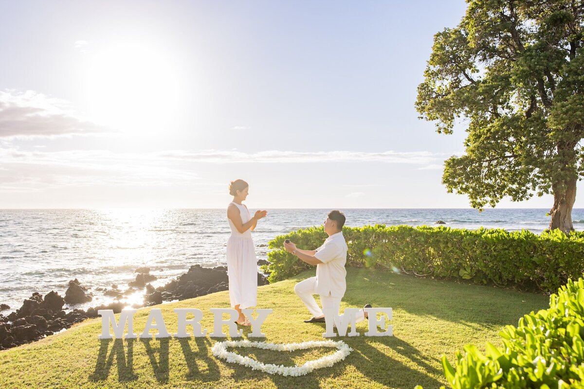 Hawaii beach proposal with floral setup