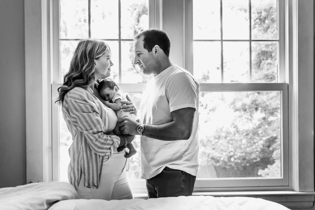 mom and dad with baby long island newborn photographer