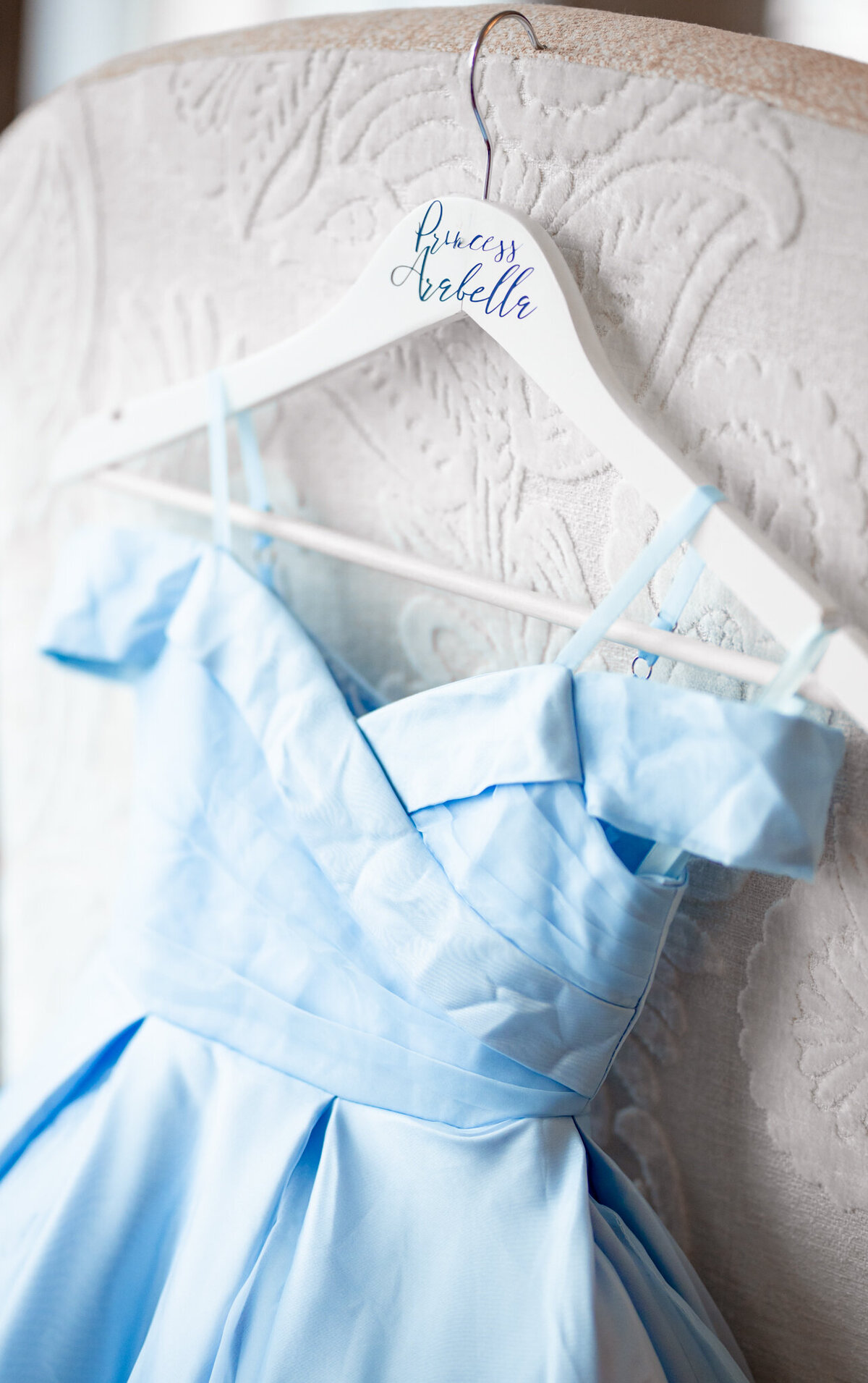 flower girl dress on a hanger