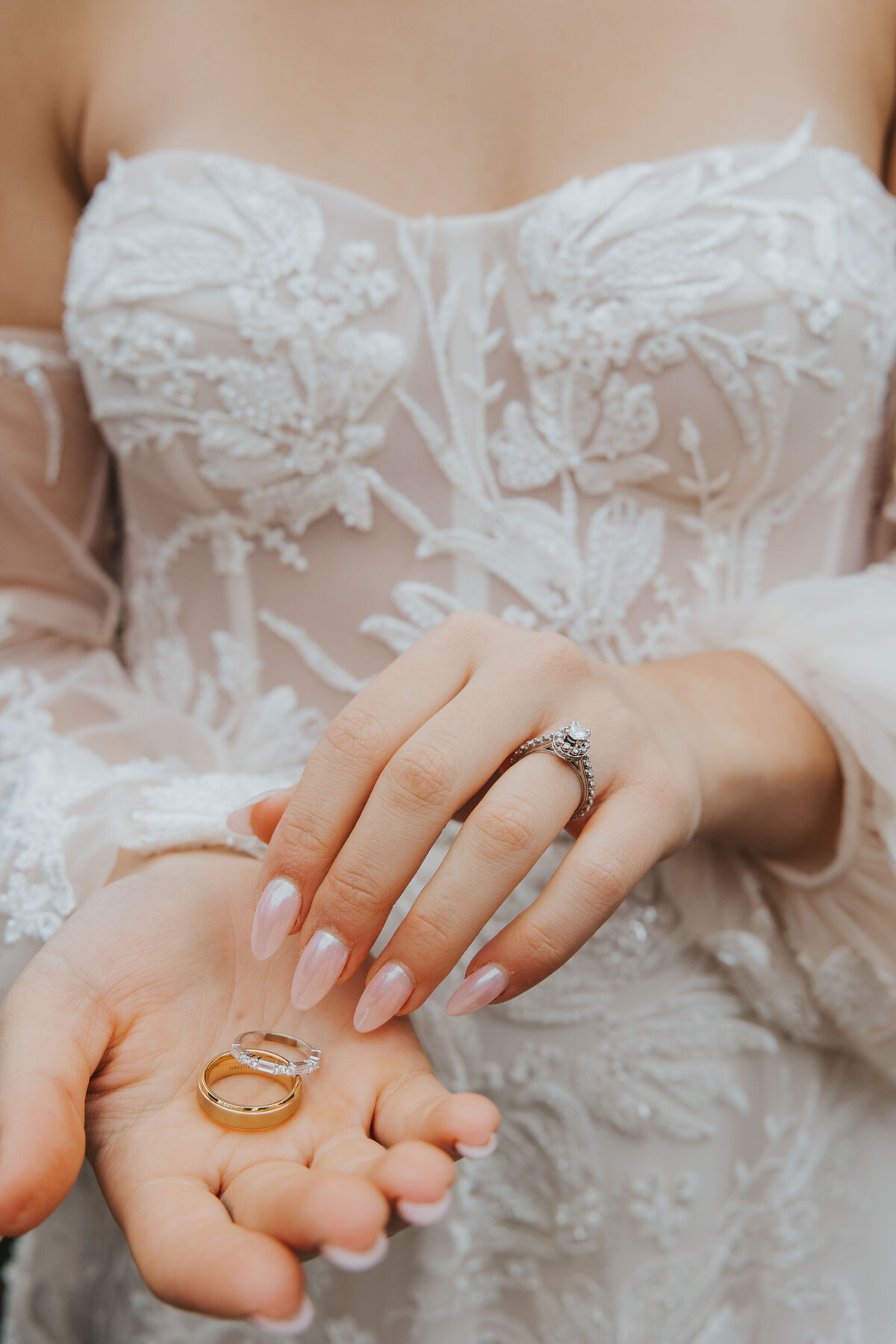 details of rings in a brides hand