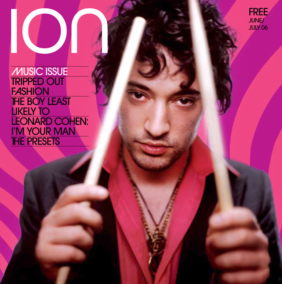 Magazine Cover Publication Ion featuring drummer holding drumsticks to his head against pink and purple swirled background