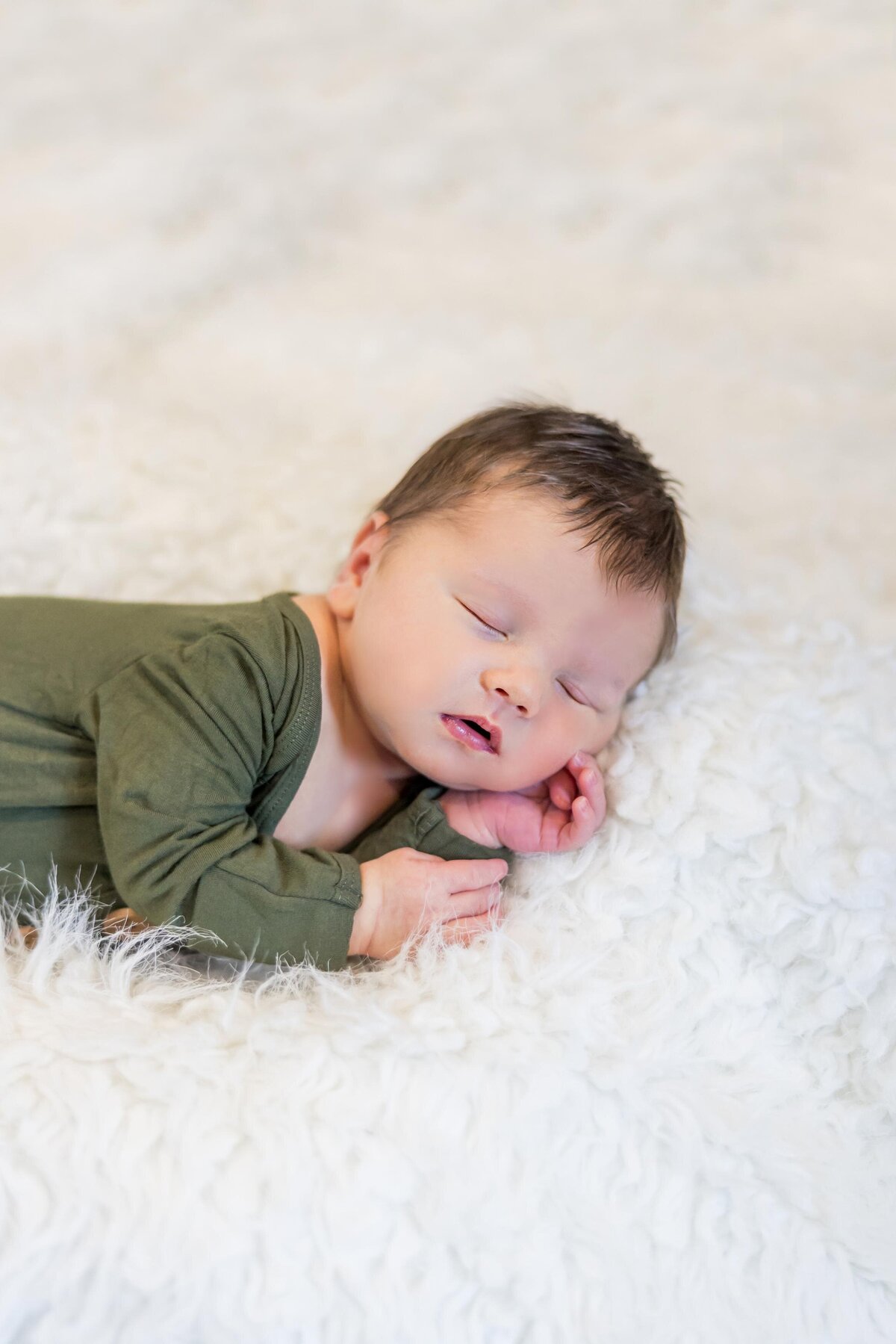 in home lifestyle newborn photo session baby boy