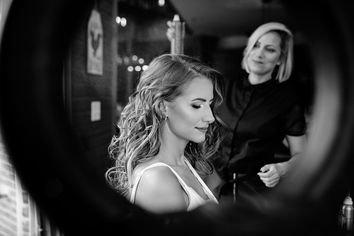 Bride getting her hair done by hairdresser