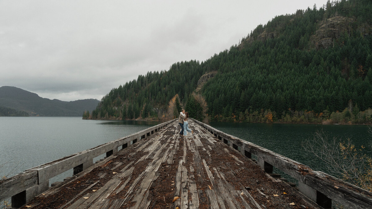 Couple on a trestle bridge in Campbell River during their engagement session by latitude 49 photography