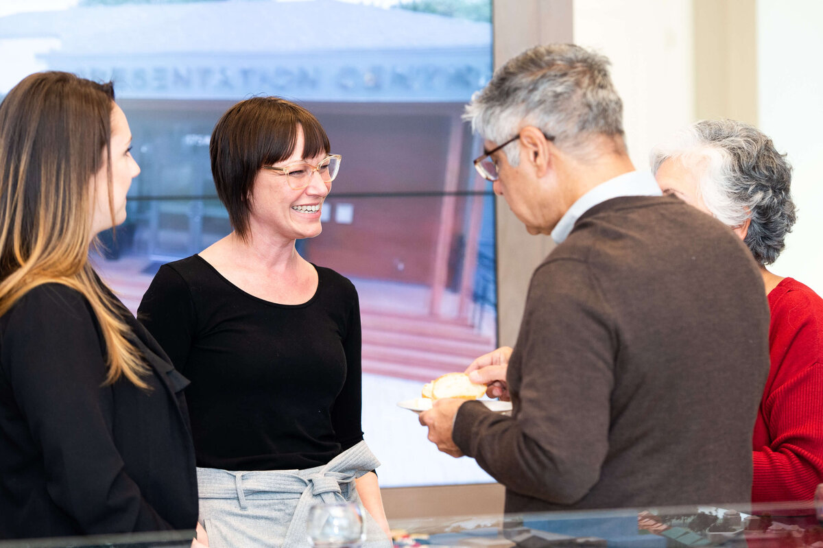 the eQ team mingling and chatting with guests during the Groundbreaking event.  the host of eQ addressing and welcoming guests to the eQ Groundbreaking event.  Captured by Ottawa Event Photographer JEMMAN Photography COMMERCIAL