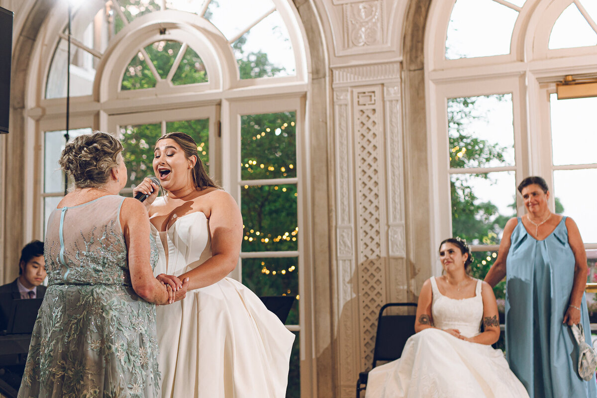 A bride serenades her mom with a surprise song at Armour House in Lake Forest.