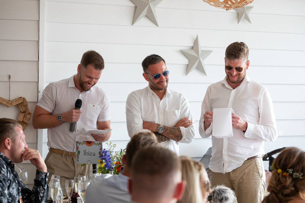 Best men giving their speeches at Tunnels Beaches wedding in Devon