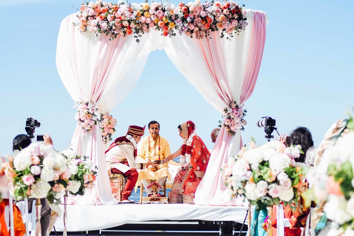 Vibrant colorful  outdoor Indian wedding designed by Seattle wedding florist Flora Nova Design.