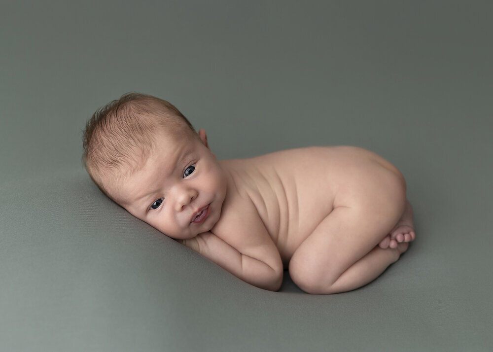NEWBORN_BABYBOYPOSEDGREEN