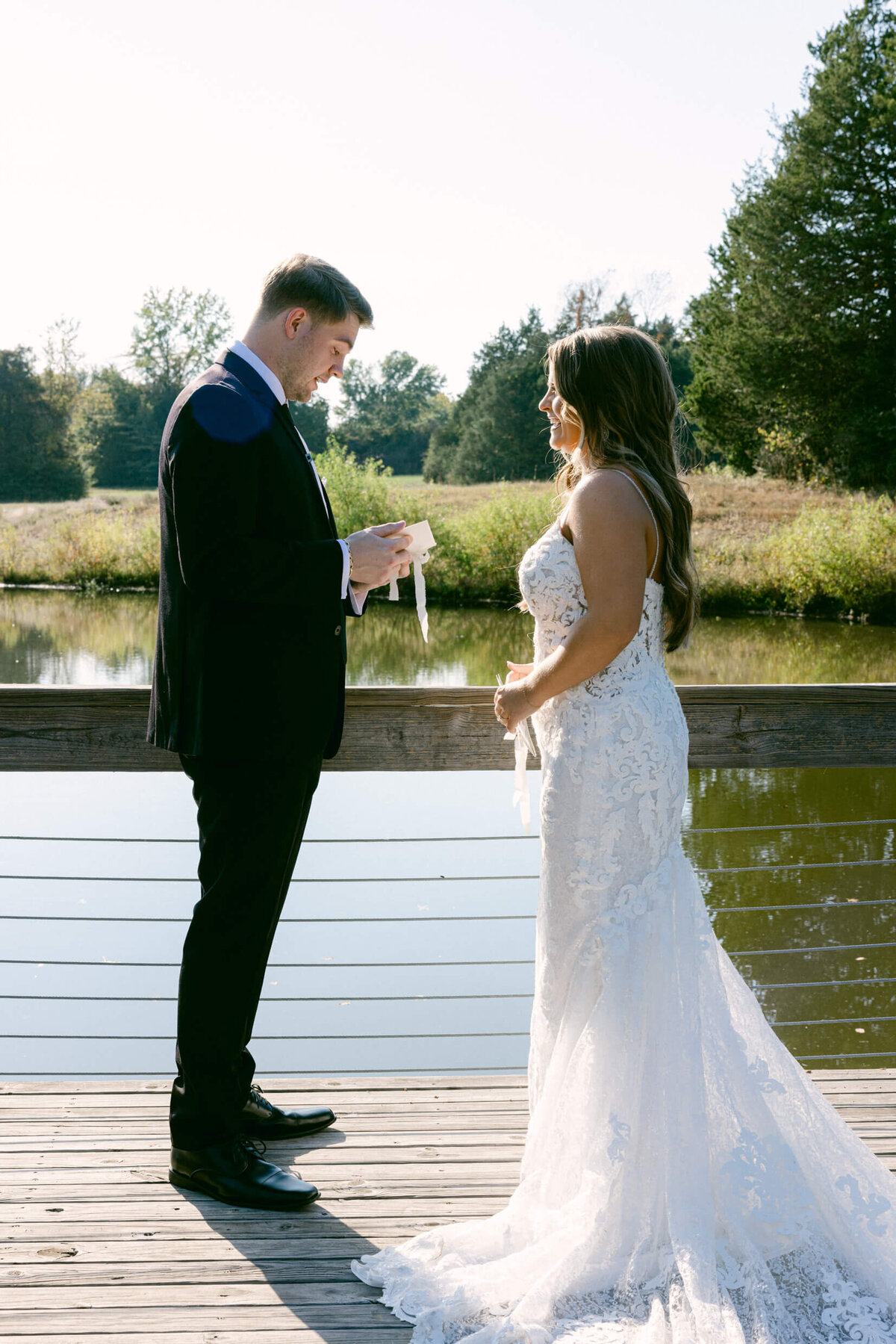 A wedding photo of a bride and groom during their first look