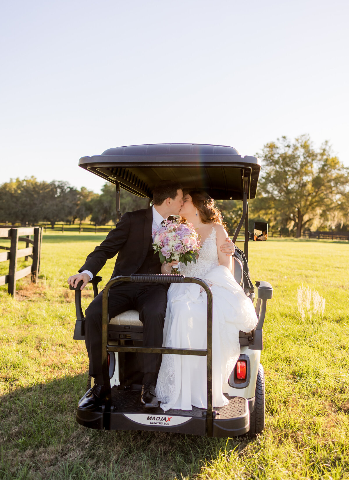 Bride and Groom on golf cart at wedding Orlando Florida captured by Orlando Wedding Photographer Blak Marie Photography