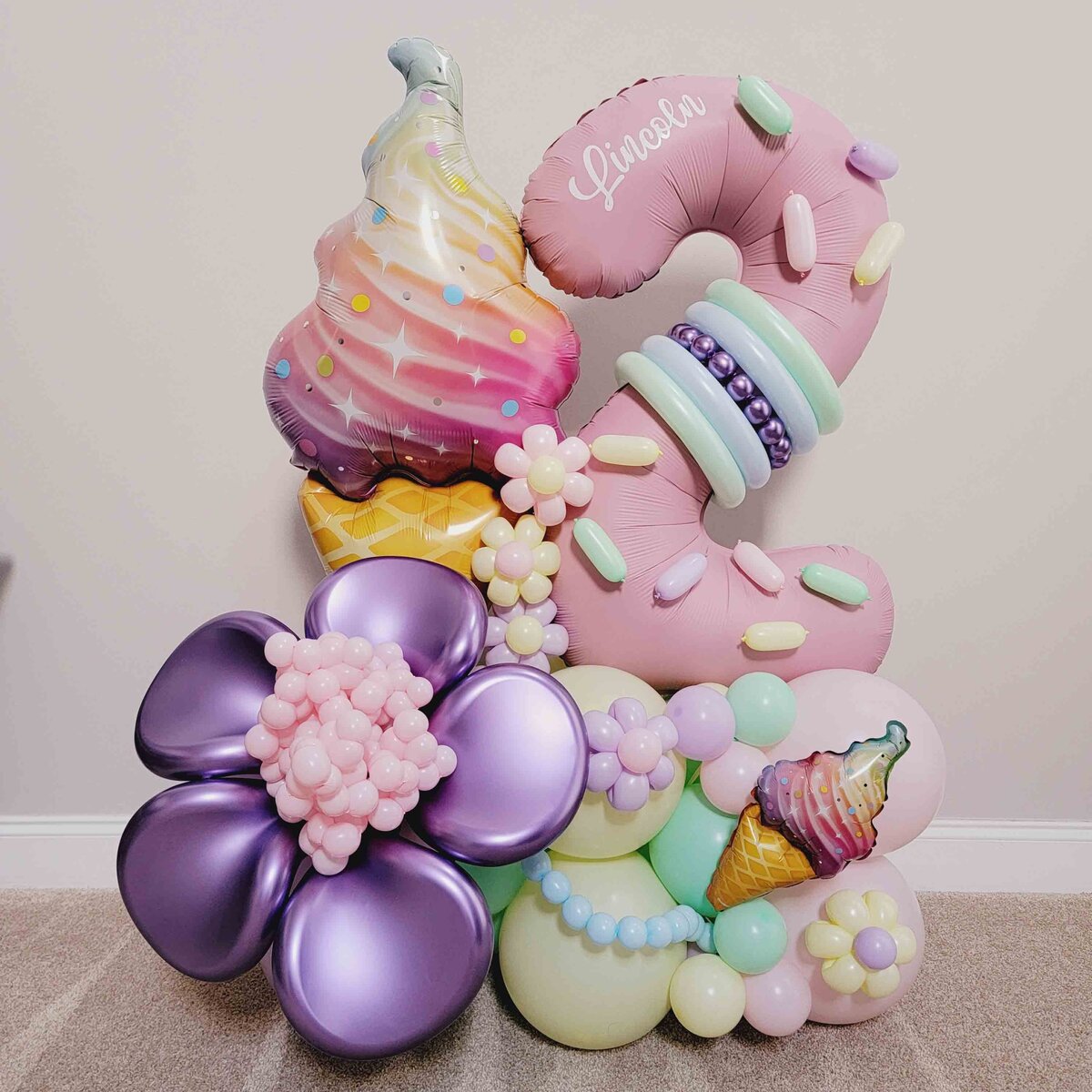 The sweetness of celebrations with Air with Flair Decor's Premium Balloon Bouquet featuring an enticing Ice Cream and Purple Flower theme for girls. The girl's celebration with the premium touch of our expertly crafted balloon