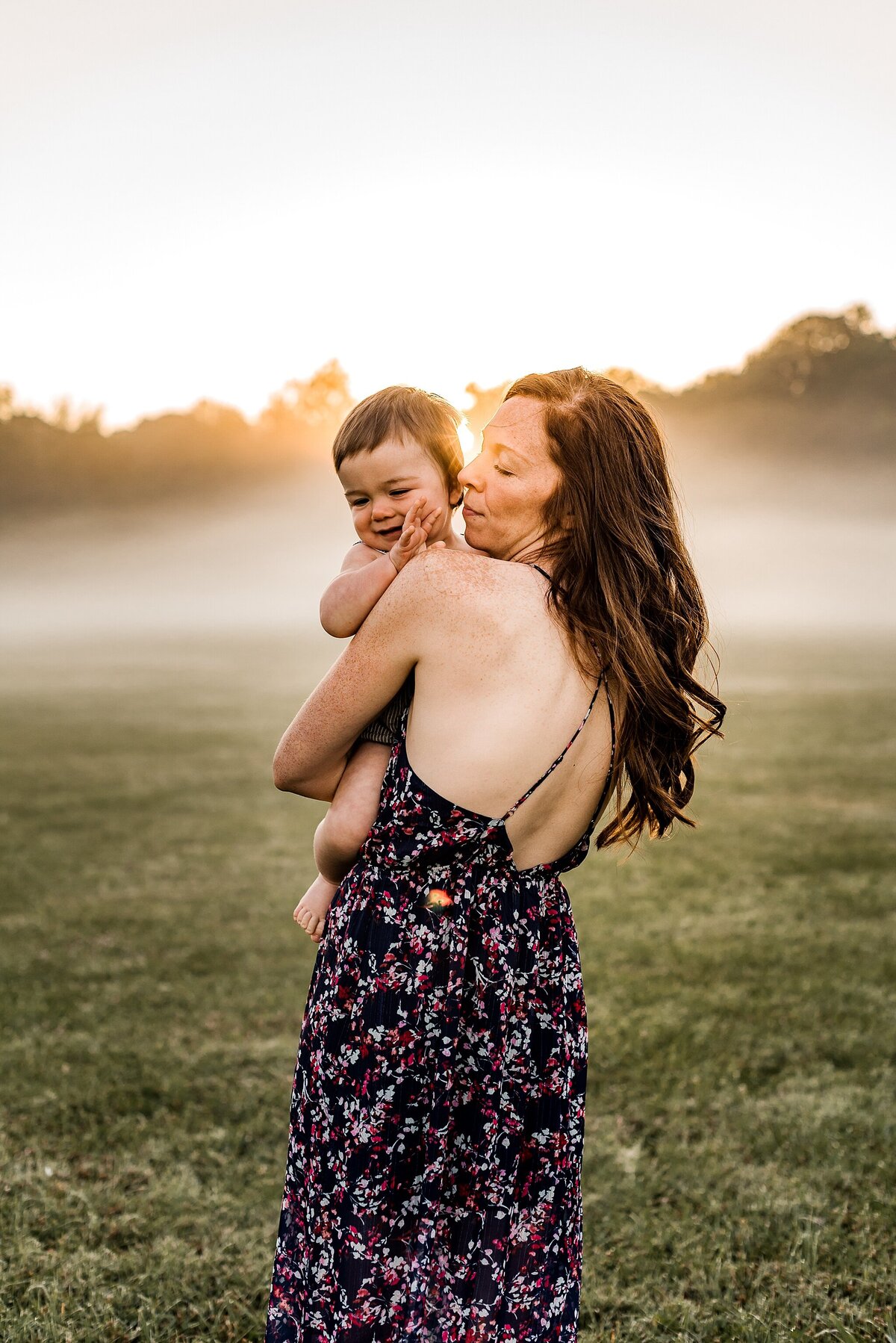 Mother and Son in field with fog