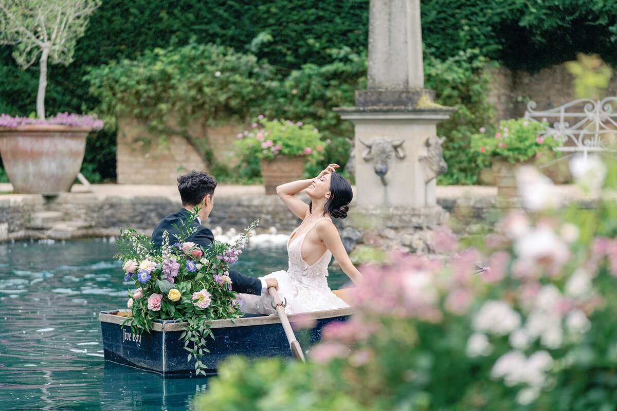 Bride and groom on the lake at Euridge Manor
