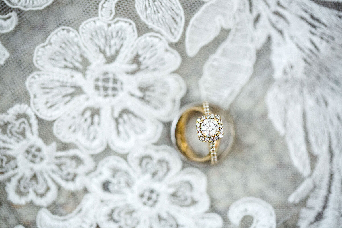 diamond ring sitting on veil.