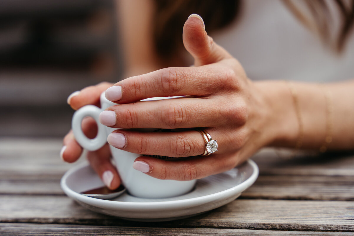 Bride showing wedding ring hand detail