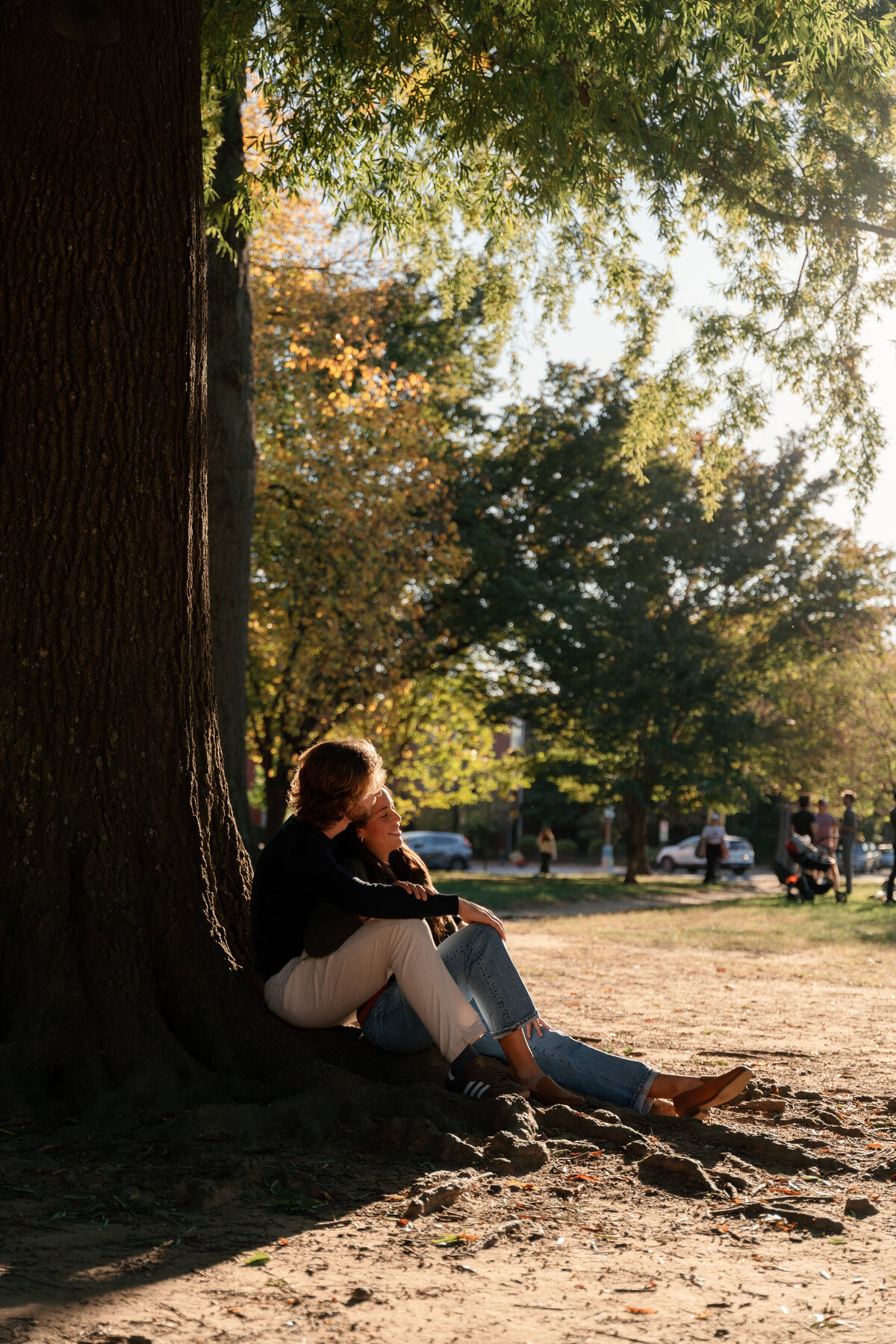couple-sitting-together-on-tree