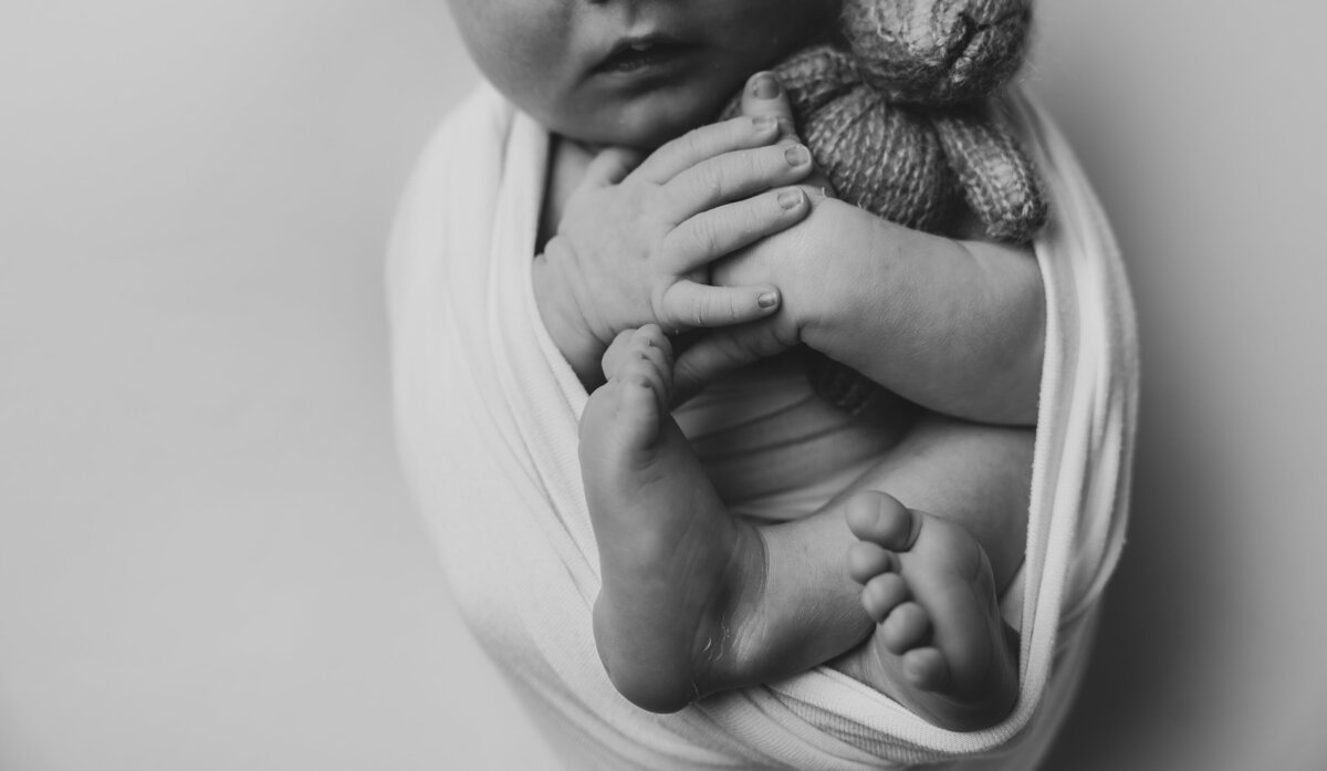 baby hugging teddy 