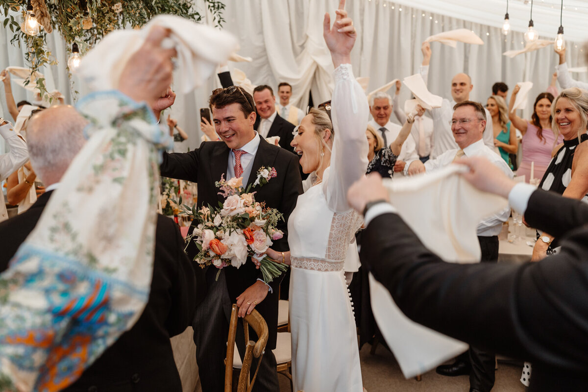 Hamswell House Wedding Breakfast - Napkins Cheering Entrance to Marquee