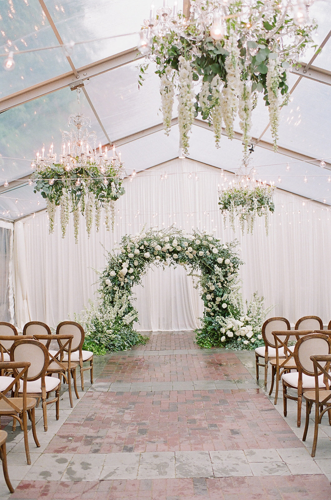 Chicago Illuminating Co. Tent Wedding with Lush Floral Arch_17