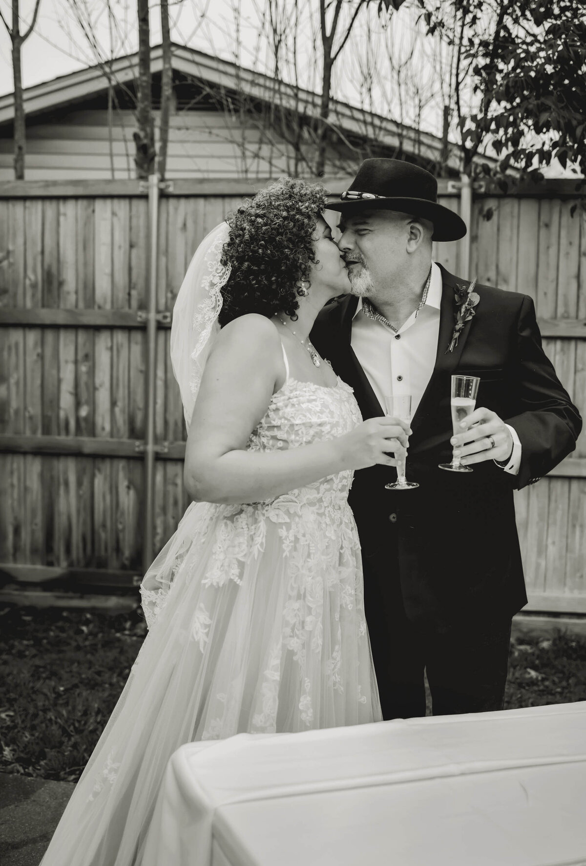 the bride and groom kiss at their small wedding in dallas texas
